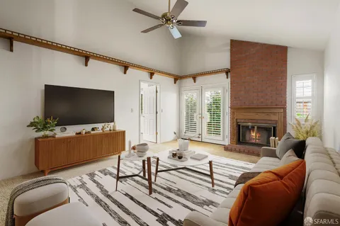 a kitchen with a table chairs sink and refrigerator