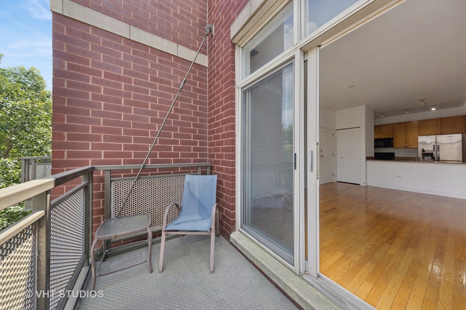 765 West 15th Street, Unit 309 Chicago, IL 60607 - Photo 3 of 14 a view of a balcony with chairs