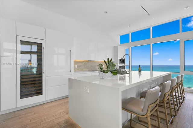 a view of living room with furniture and wooden floor