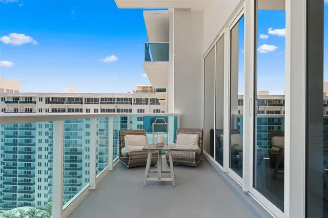 a bedroom with a bed and a view of kitchen