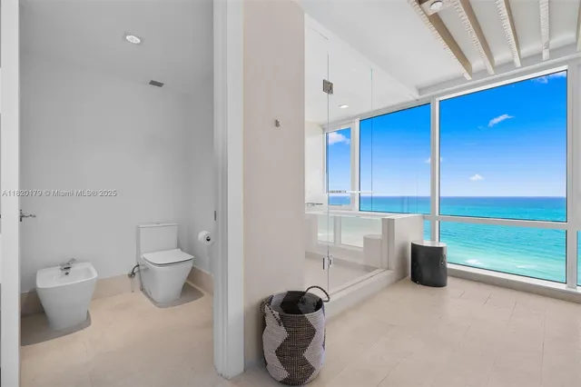 a view of an ocean and a yard