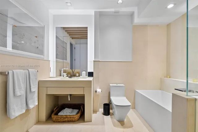a view of a dining room with furniture and a floor to ceiling window