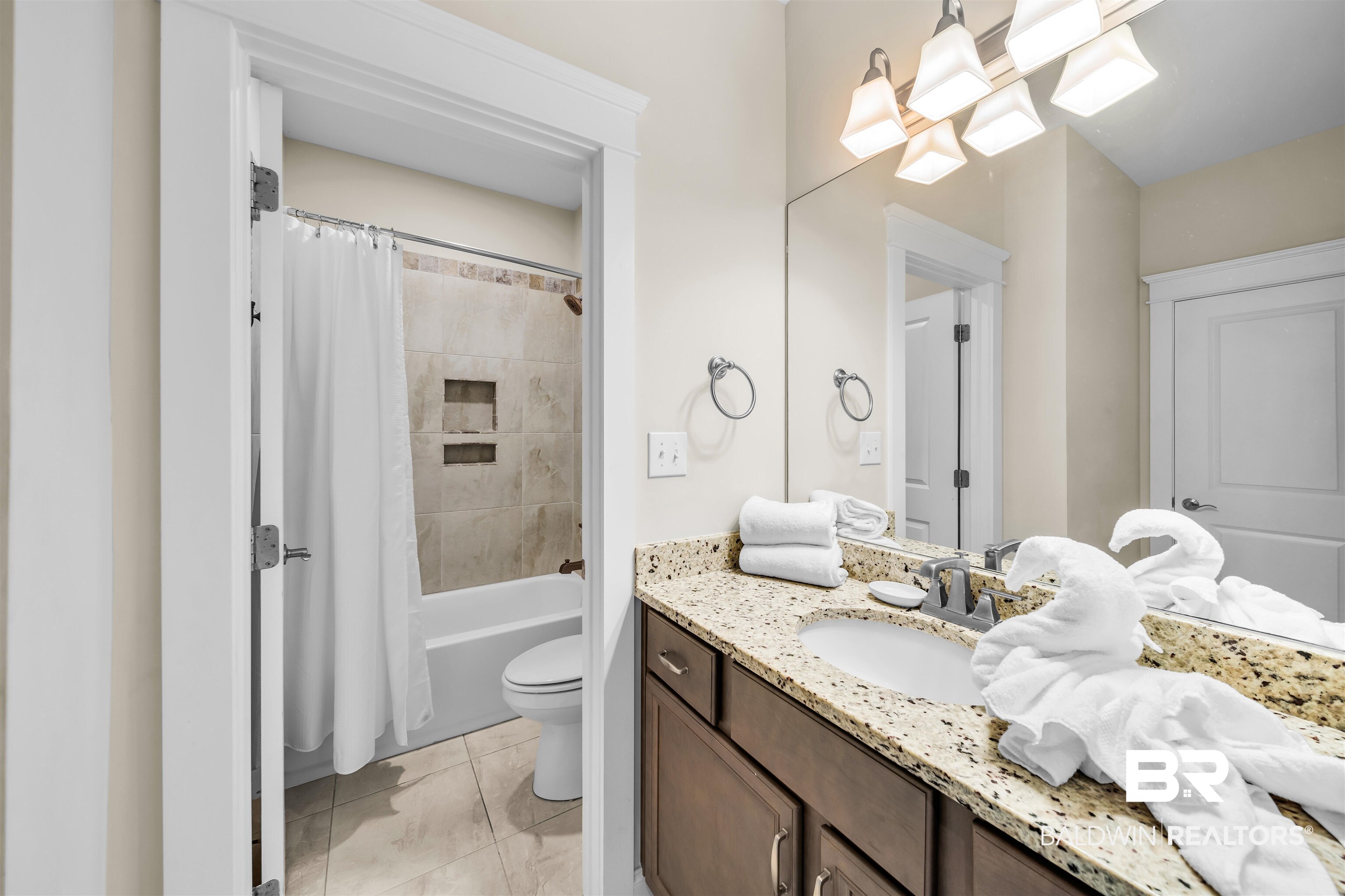47 Parks Edge Orange Beach, AL 36561 - Photo 23 of 40 Full bath featuring vanity, shower / bath combination with curtain, and tile patterned floors