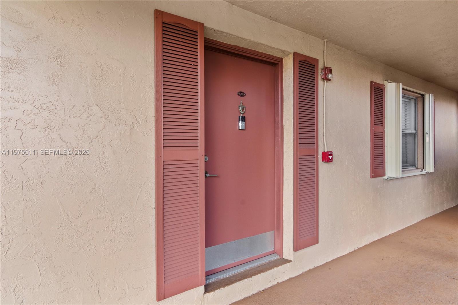 11209 Southwest 88th Street, Unit 101B Miami, FL 33176 - Photo 11 of 28 a view of front door