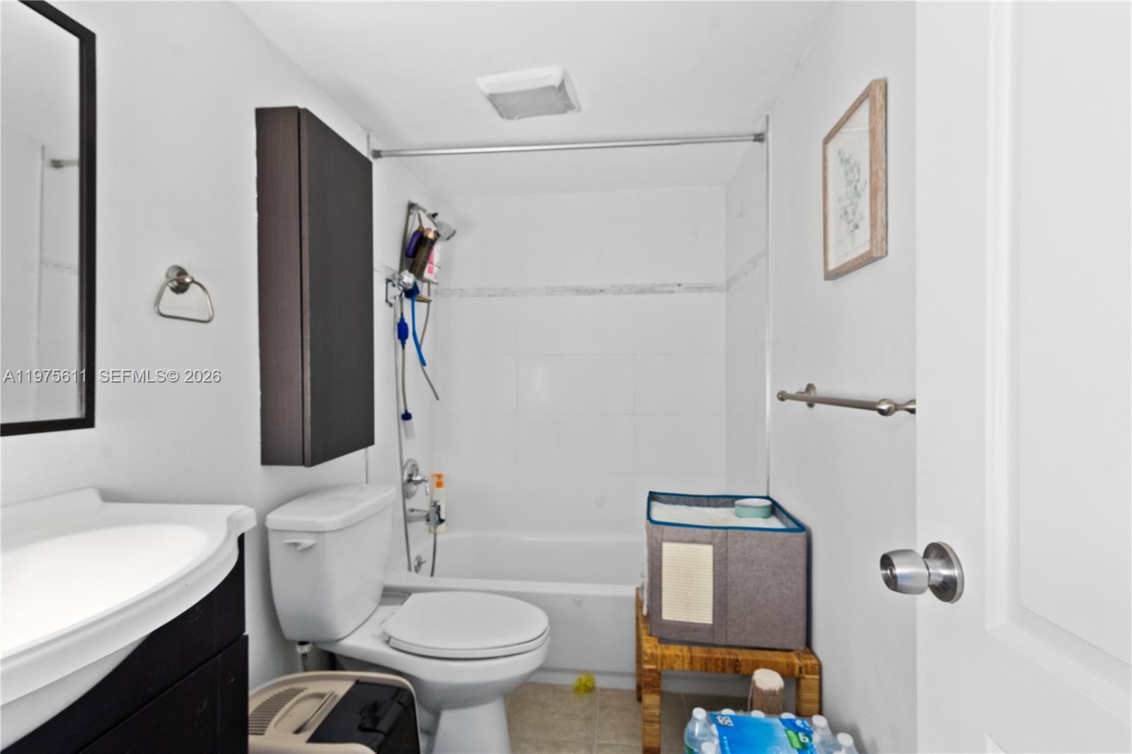 11209 Southwest 88th Street, Unit 101B Miami, FL 33176 - Photo 23 of 28 a bathroom with a sink toilet and shower