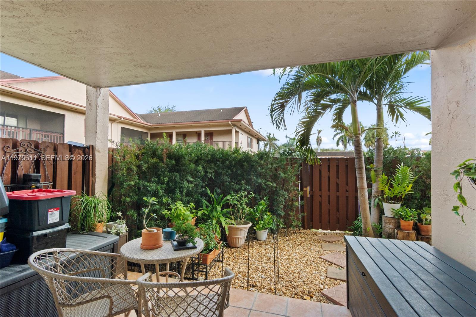 11209 Southwest 88th Street, Unit 101B Miami, FL 33176 - Photo 24 of 28 a view of outdoor space yard and patio