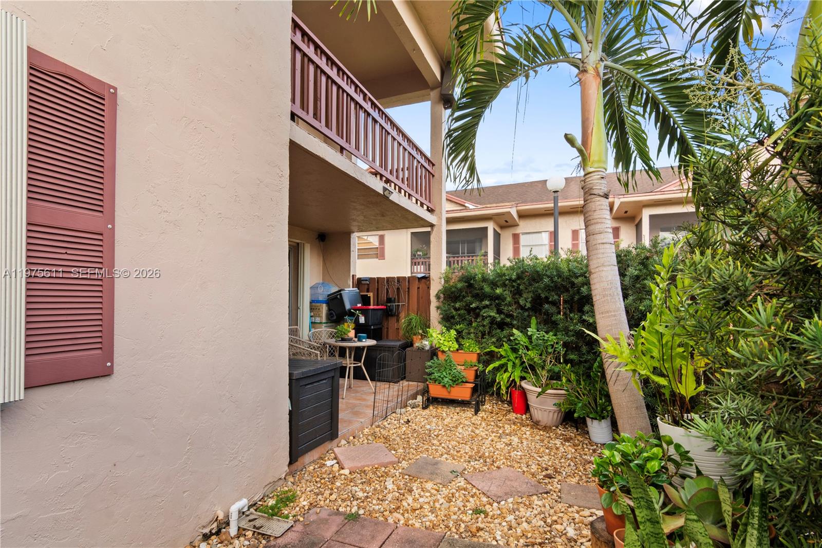 11209 Southwest 88th Street, Unit 101B Miami, FL 33176 - Photo 25 of 28 a view of outdoor space and yard