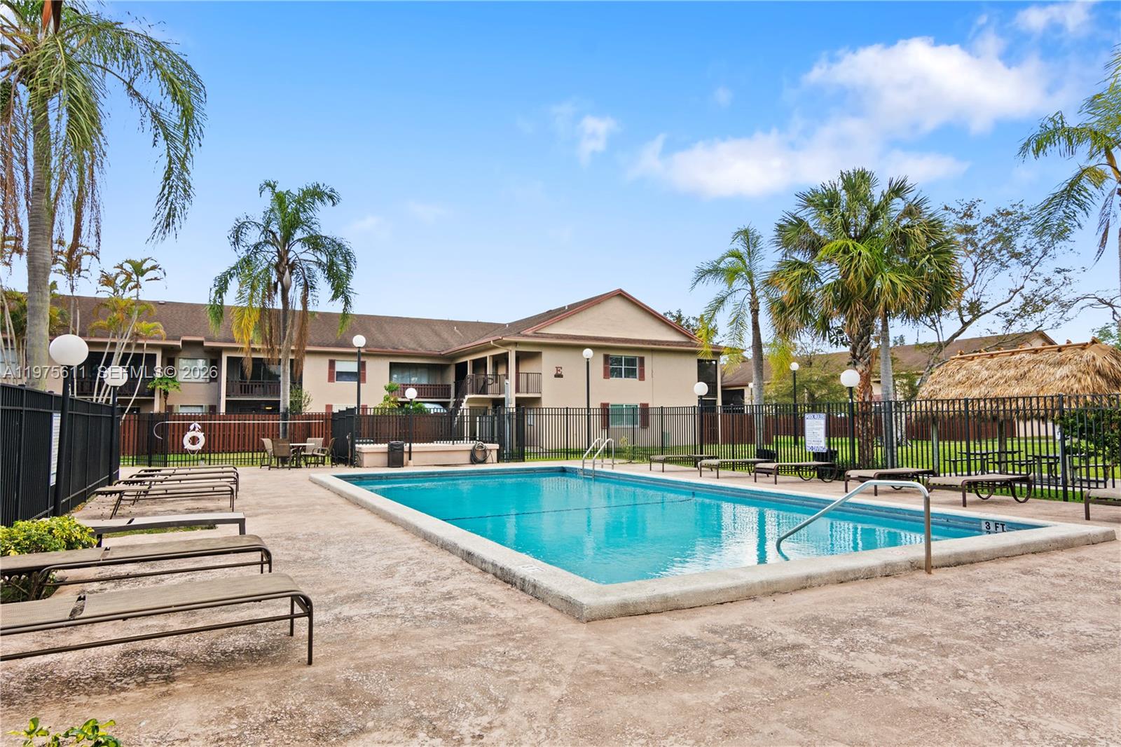 11209 Southwest 88th Street, Unit 101B Miami, FL 33176 - Photo 28 of 28 a view of a house with swimming pool and sitting area