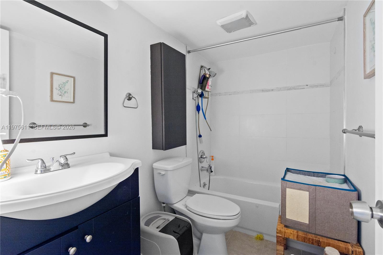 11209 Southwest 88th Street, Unit 101B Miami, FL 33176 - Photo 7 of 28 a bathroom with a sink toilet and shower