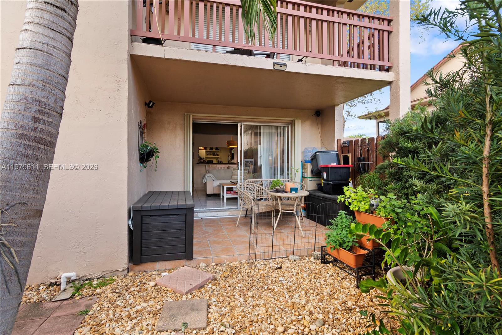 11209 Southwest 88th Street, Unit 101B Miami, FL 33176 - Photo 8 of 28 a view of outdoor dining space with a patio