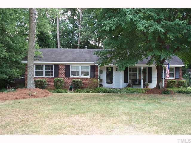 616 Duke Drive Raleigh, NC 27609 - Photo 1 of 8 a front view of a house with a garden