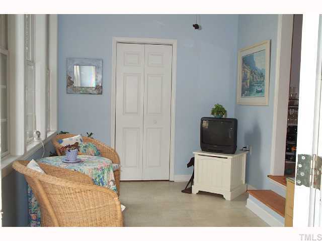 616 Duke Drive Raleigh, NC 27609 - Photo 5 of 8 a living room with furniture and a flat screen tv