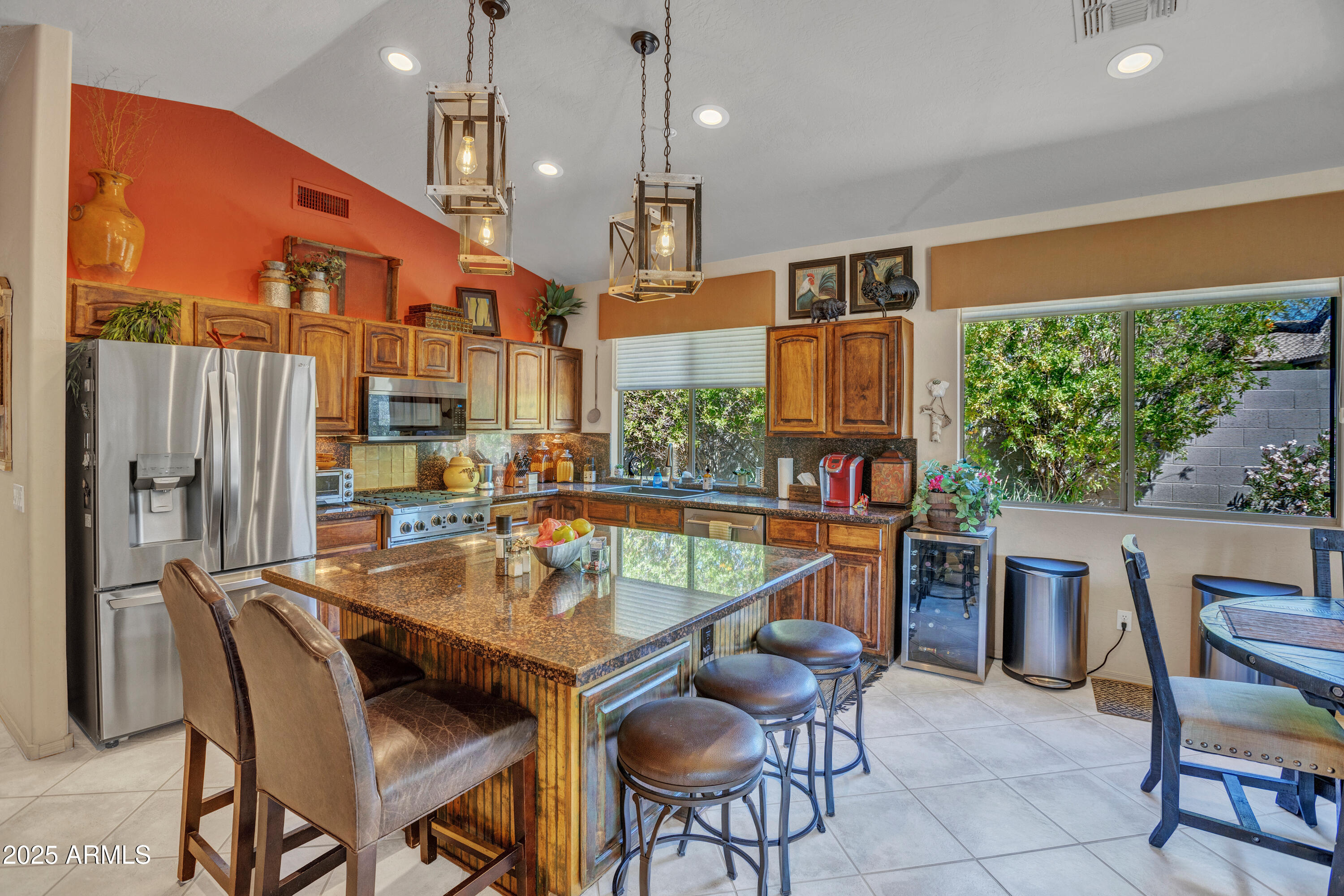 10655 East Acacia Drive Scottsdale, AZ 85255 - Photo 14 of 46 a view of a dining room with furniture window and outside view