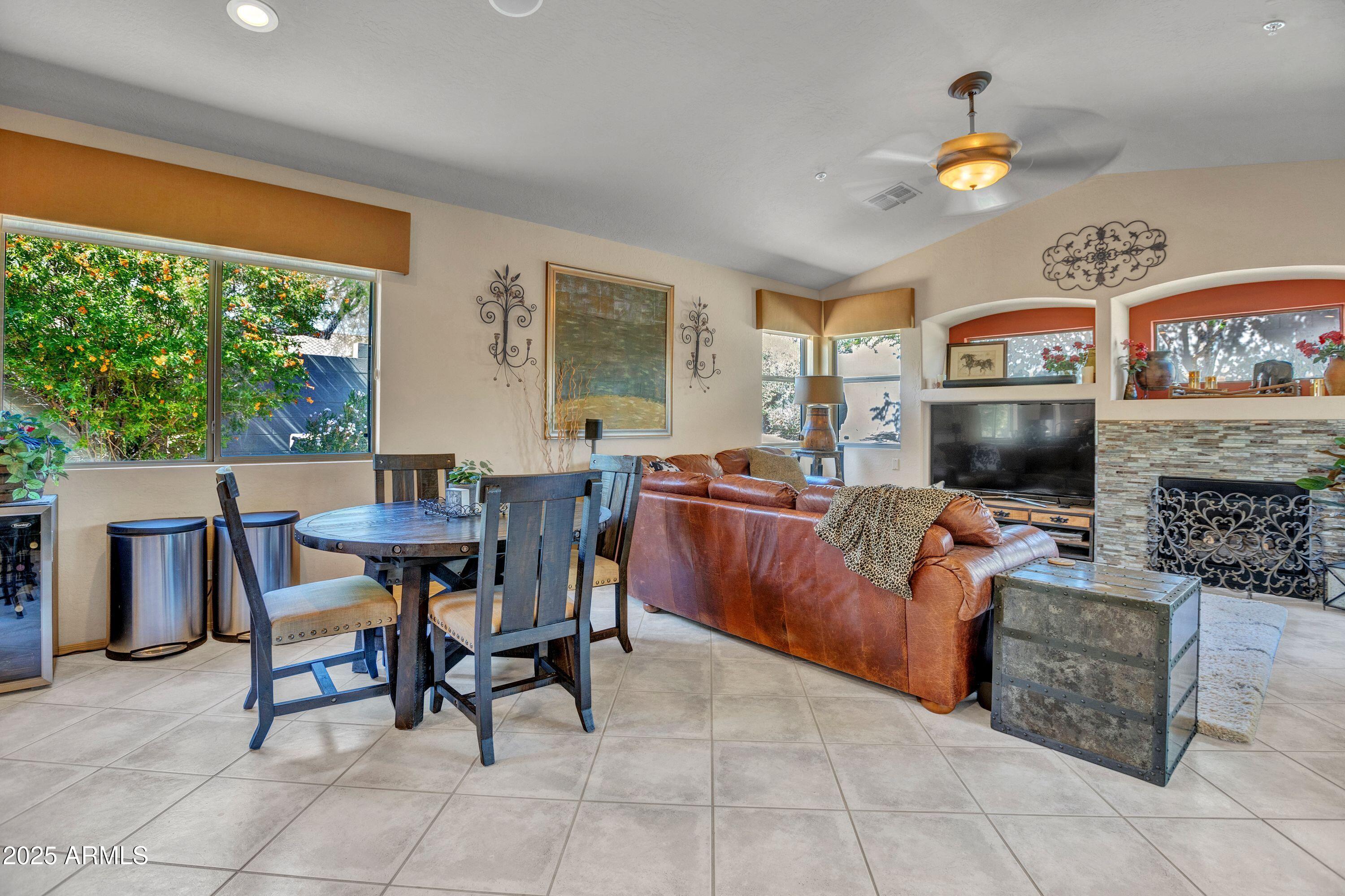 10655 East Acacia Drive Scottsdale, AZ 85255 - Photo 23 of 46 a living room with furniture and a flat screen tv