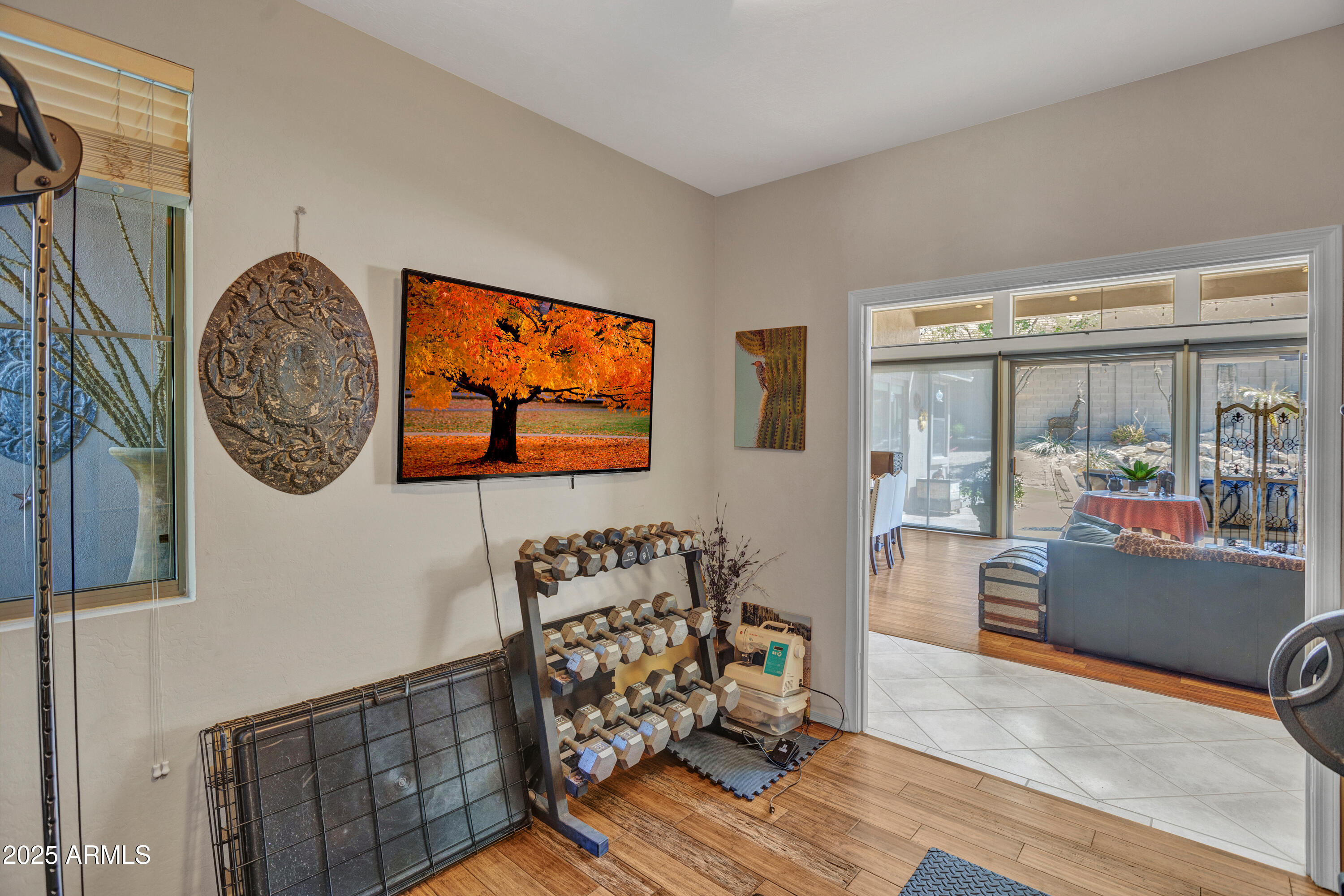 10655 East Acacia Drive Scottsdale, AZ 85255 - Photo 26 of 46 a view of a livingroom with wooden floor and furniture