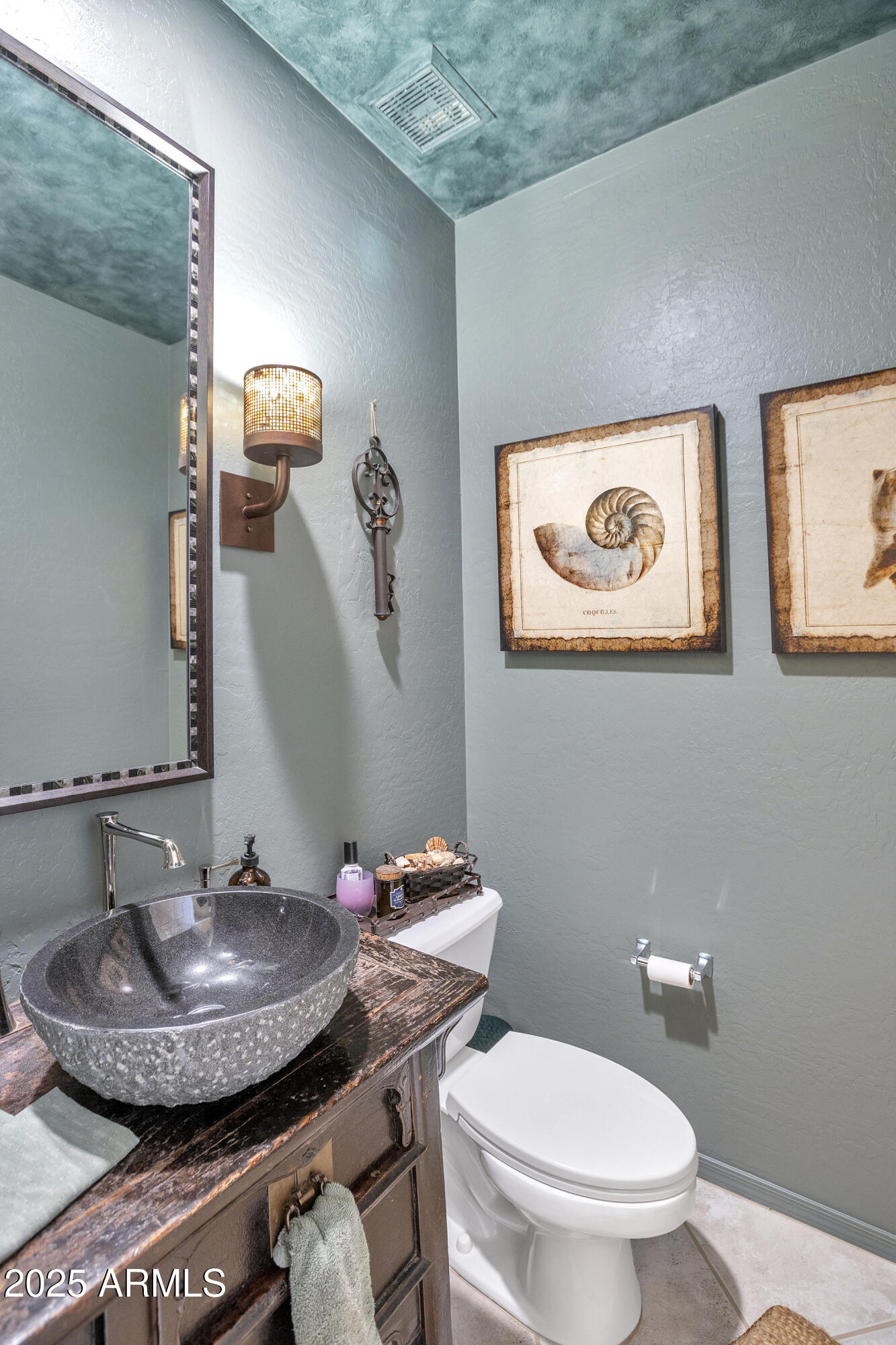 10655 East Acacia Drive Scottsdale, AZ 85255 - Photo 27 of 46 a bathroom with a toilet and a sink
