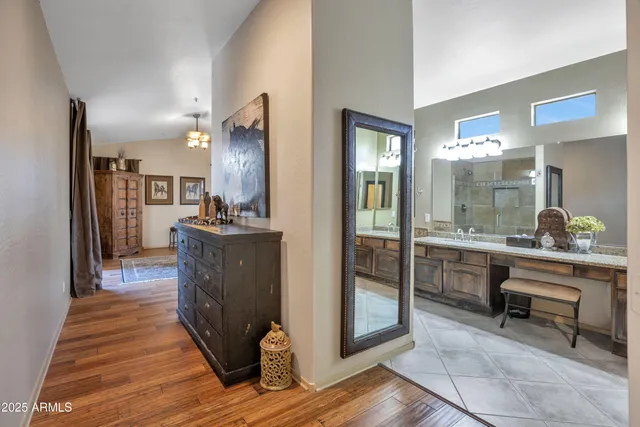 a kitchen with counter top space and wooden floor