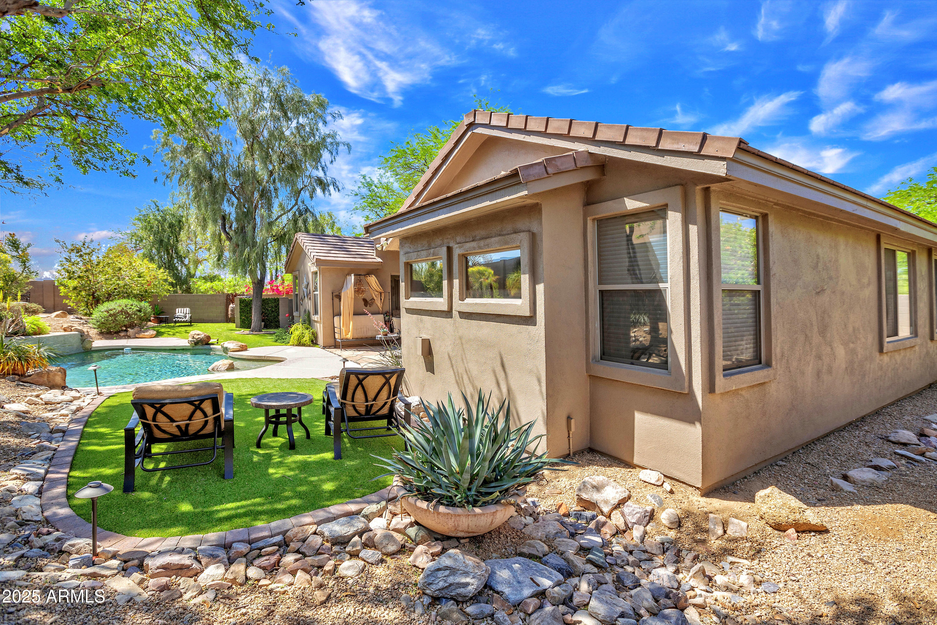 10655 East Acacia Drive Scottsdale, AZ 85255 - Photo 39 of 46 a view of a house with backyard and sitting area