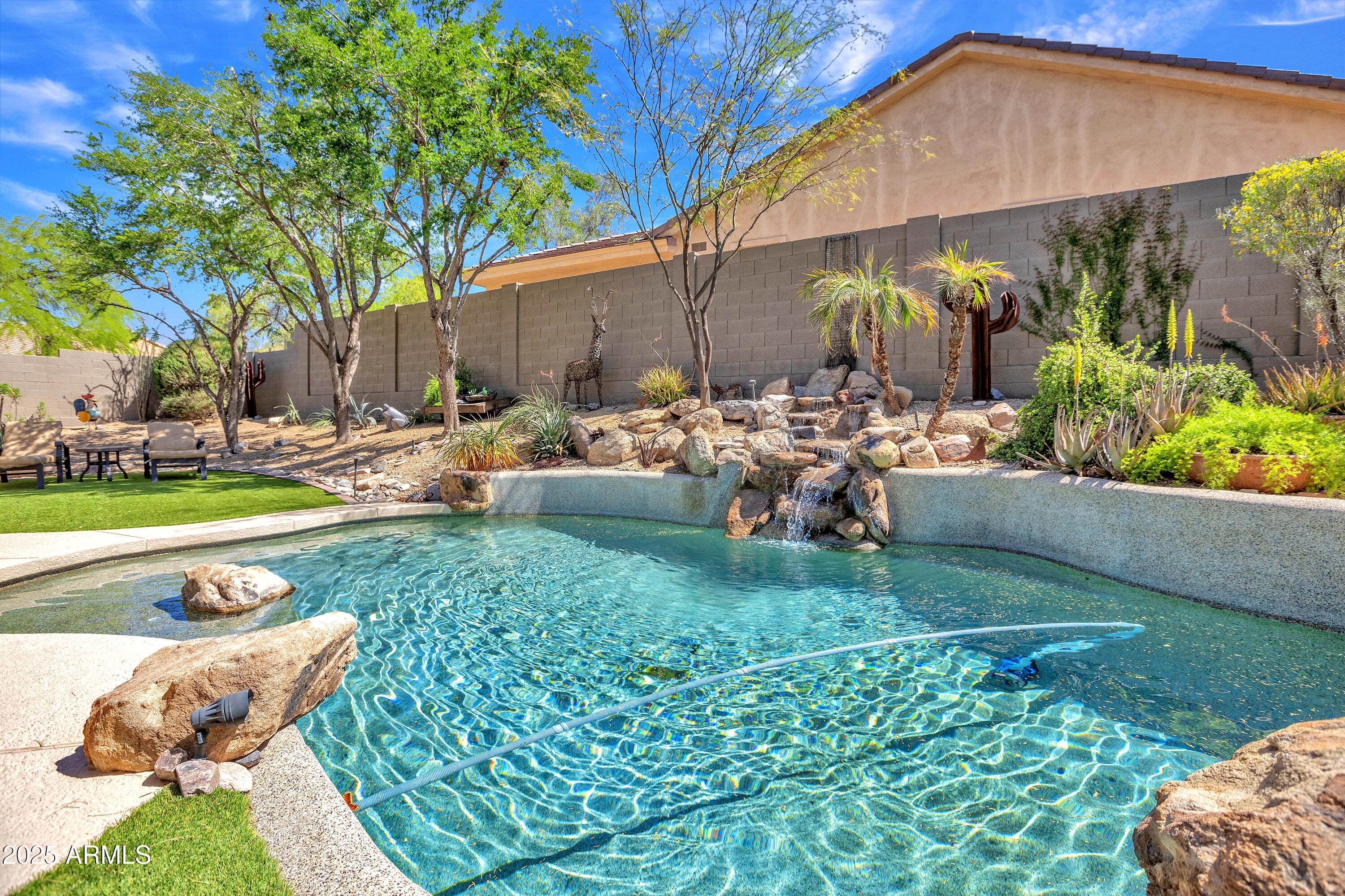 10655 East Acacia Drive Scottsdale, AZ 85255 - Photo 43 of 46 a view of a backyard with plants and a patio