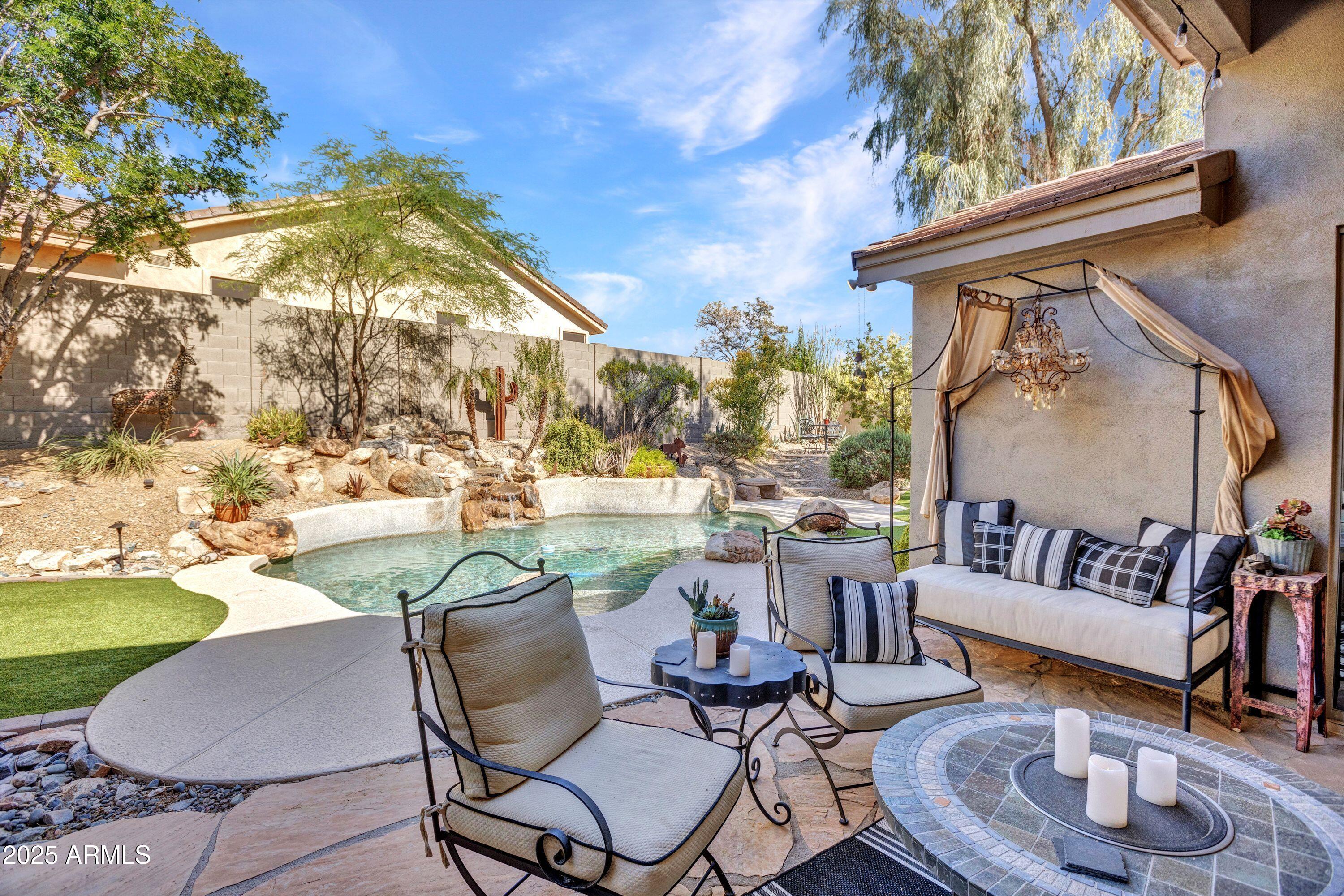 10655 East Acacia Drive Scottsdale, AZ 85255 - Photo 44 of 46 a view of a swimming pool with furniture
