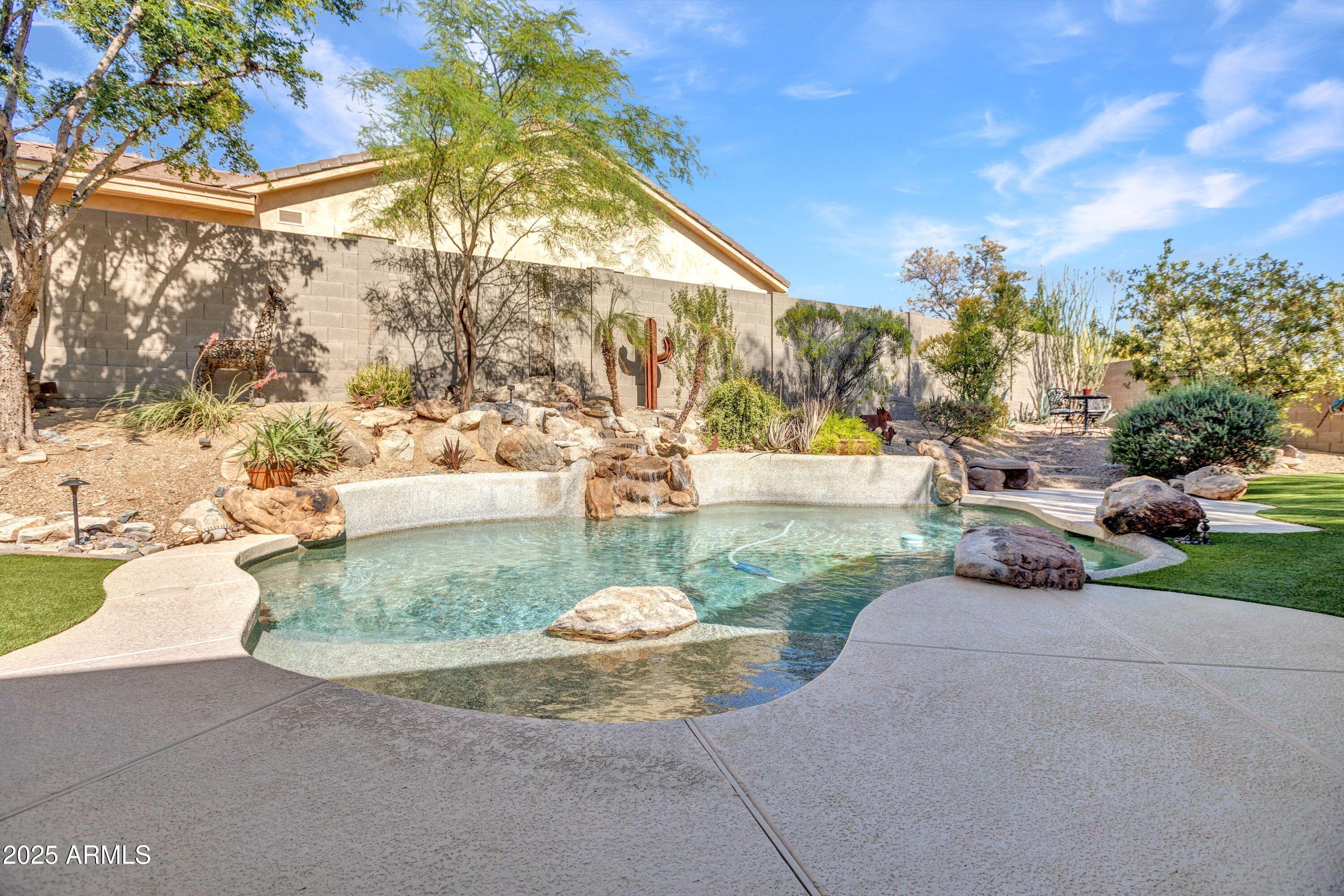 10655 East Acacia Drive Scottsdale, AZ 85255 - Photo 46 of 46 a view of a garden with a patio