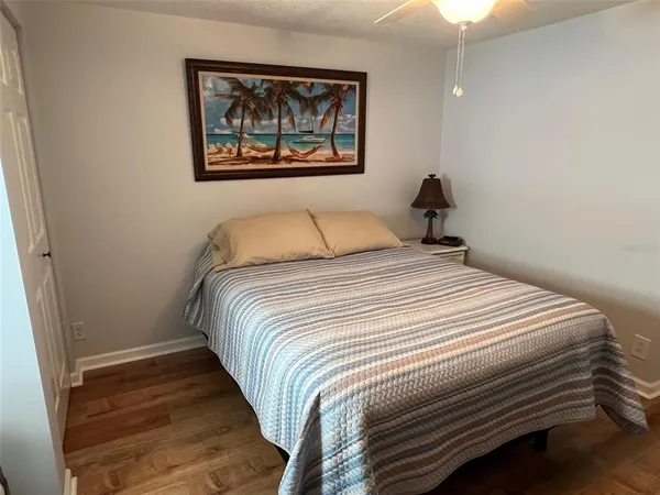 a bedroom with furniture and window