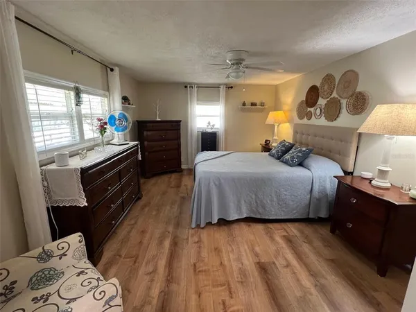 a bed room with a bed and a lamp