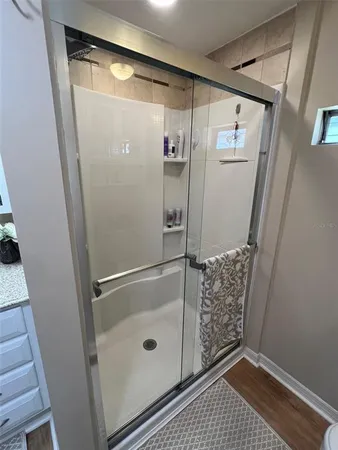 a white toilet sitting next to a bathroom sink