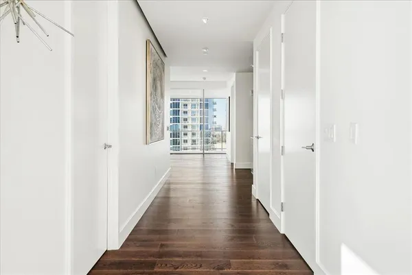 a workspace room with furniture and wooden floor