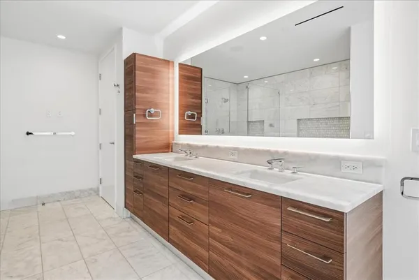 a bathroom with a bathtub and a shower