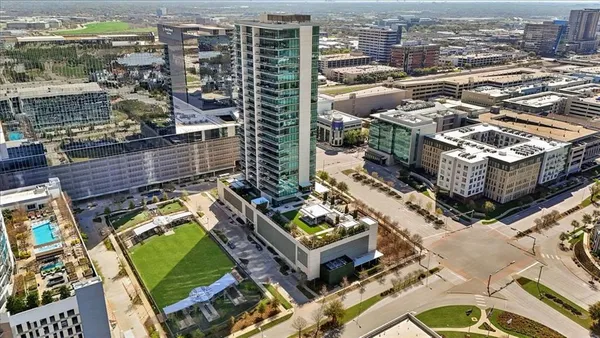 an aerial view of pool with outdoor seating