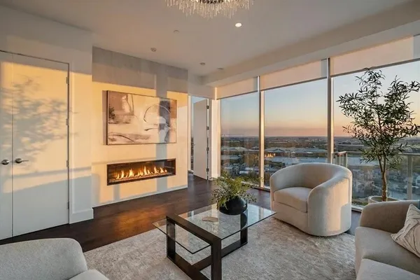 a large kitchen with a table and chairs
