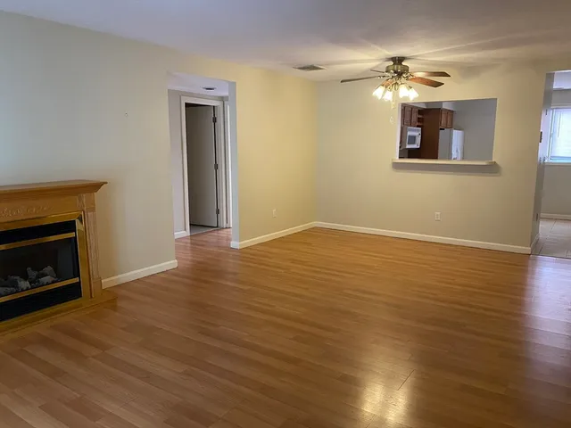an empty room with windows and closet