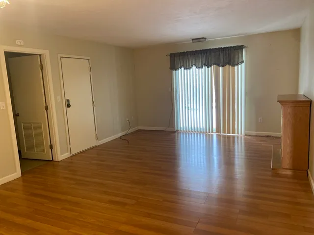 a view of an empty room with windows