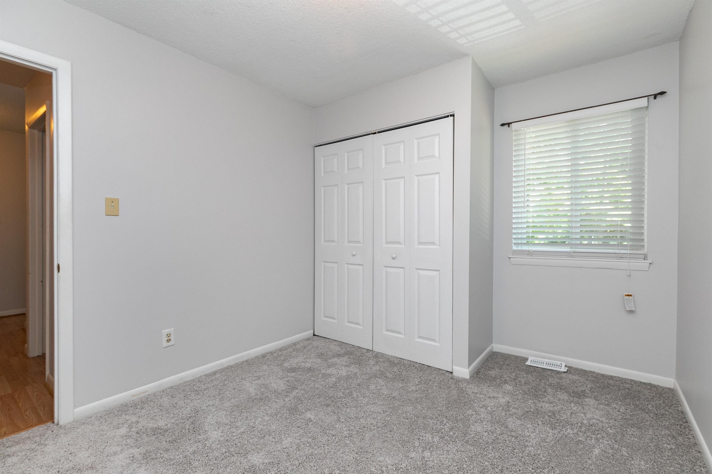 714 Godwin Court Raleigh, NC 27606 - Photo 16 of 20 Large closet, plenty of storage. New paint & carpet. Bedroom #2