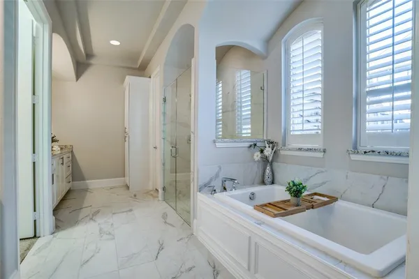 a bathroom with a granite countertop sink a mirror and a