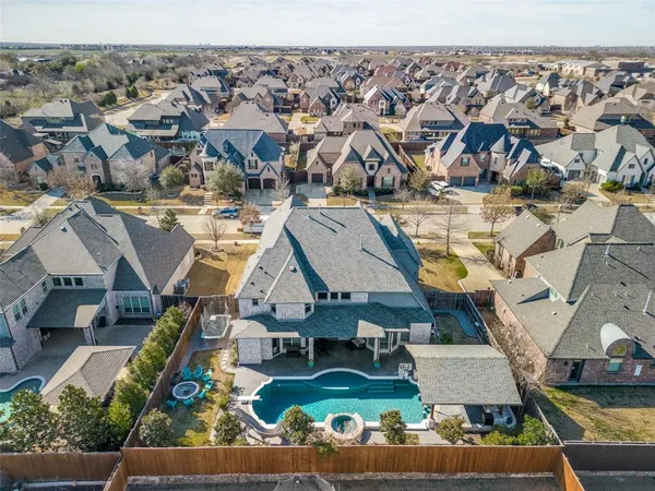 an aerial view of a house with a swimming pool