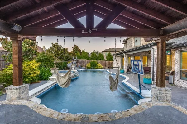 a view of pool with outdoor seating