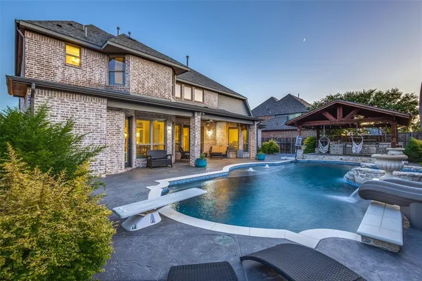 a view of pool with outdoor seating