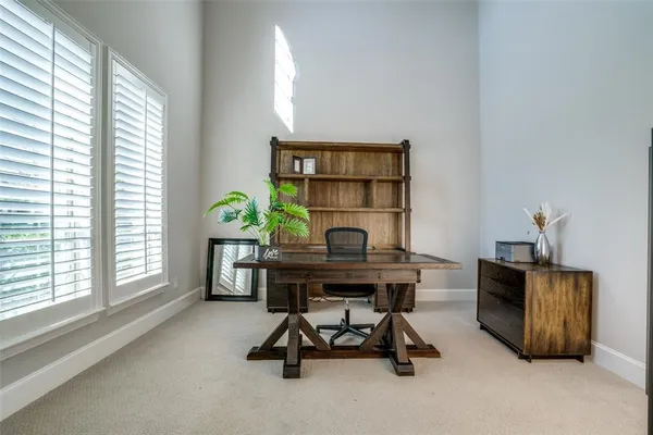 a dining room with furniture wooden floor and a chandelier