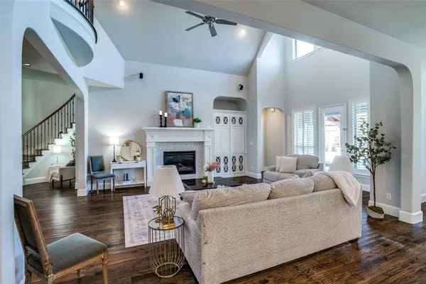 a living room with furniture and wooden floor