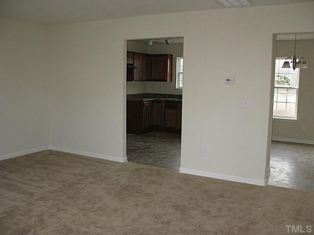 2717 Manthorp Terrace Raleigh, NC 27610 - Photo 2 of 16 an empty room with windows
