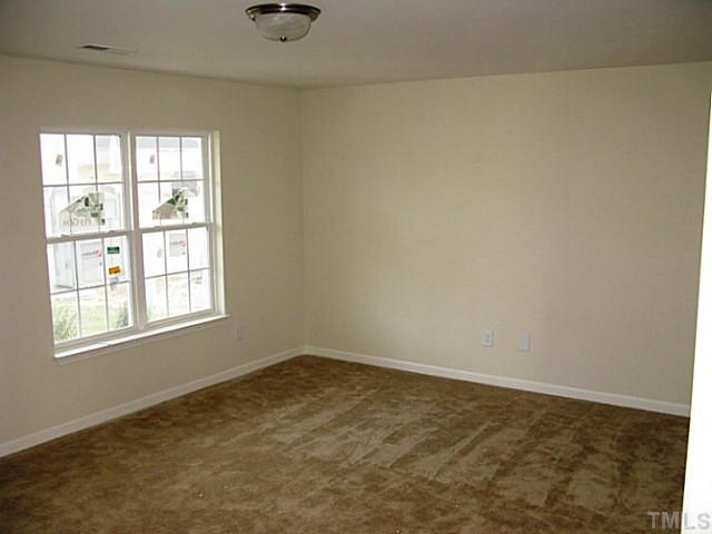 2717 Manthorp Terrace Raleigh, NC 27610 - Photo 4 of 16 an empty room with a window
