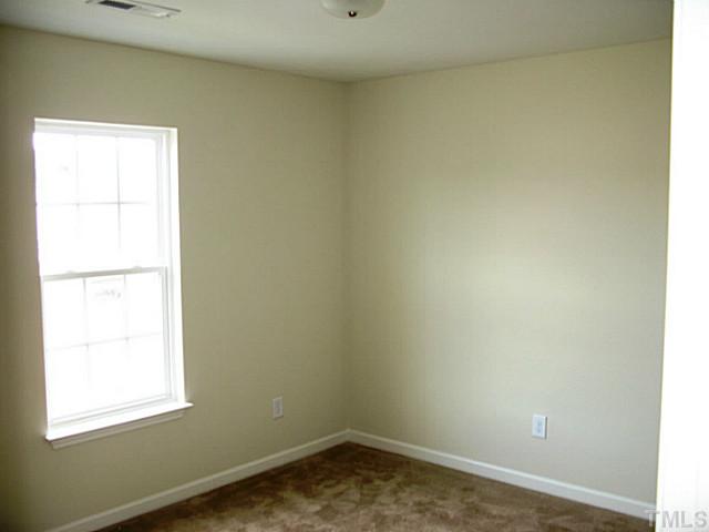 2717 Manthorp Terrace Raleigh, NC 27610 - Photo 8 of 16 an empty room with a window