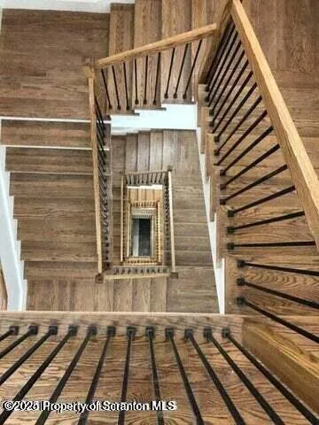 a view of a house with a door and wooden floor