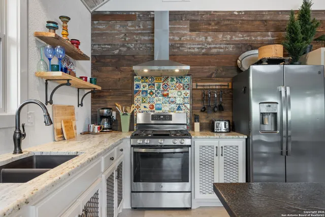 a view of a chairs and table on the balcony