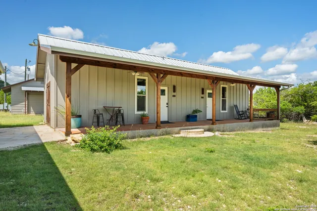 a bedroom with furniture and a chandelier