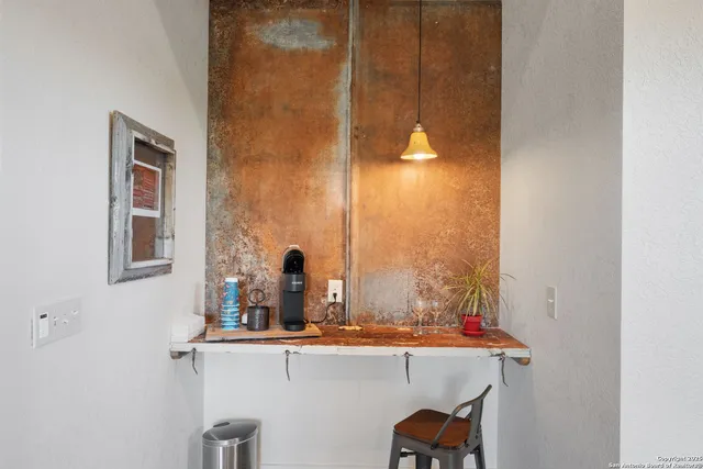 a living room with furniture and a book shelf