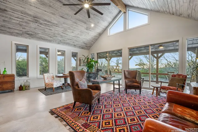 a living room with furniture and a table