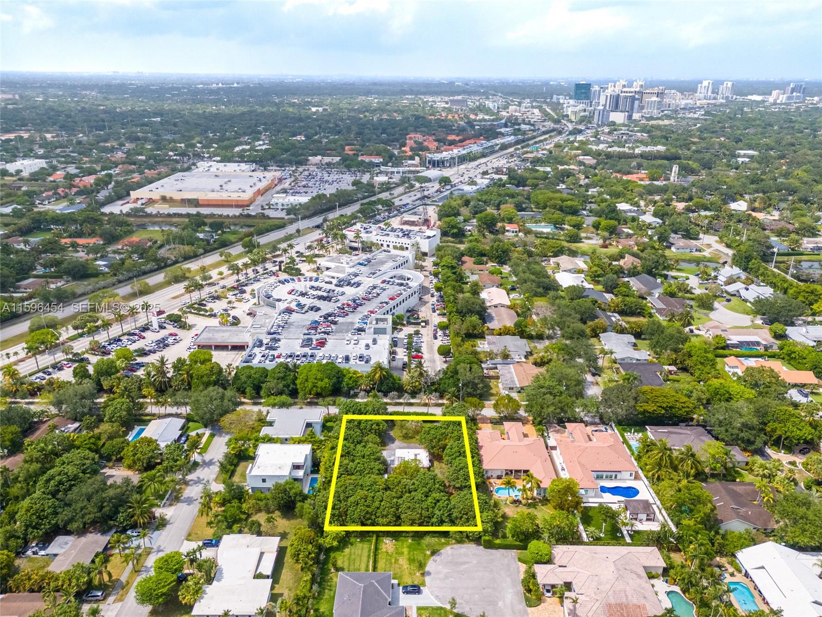 7800 Southwest 110th Street Pinecrest, FL 33156 - Photo 8 of 12 an aerial view of residential building and lake